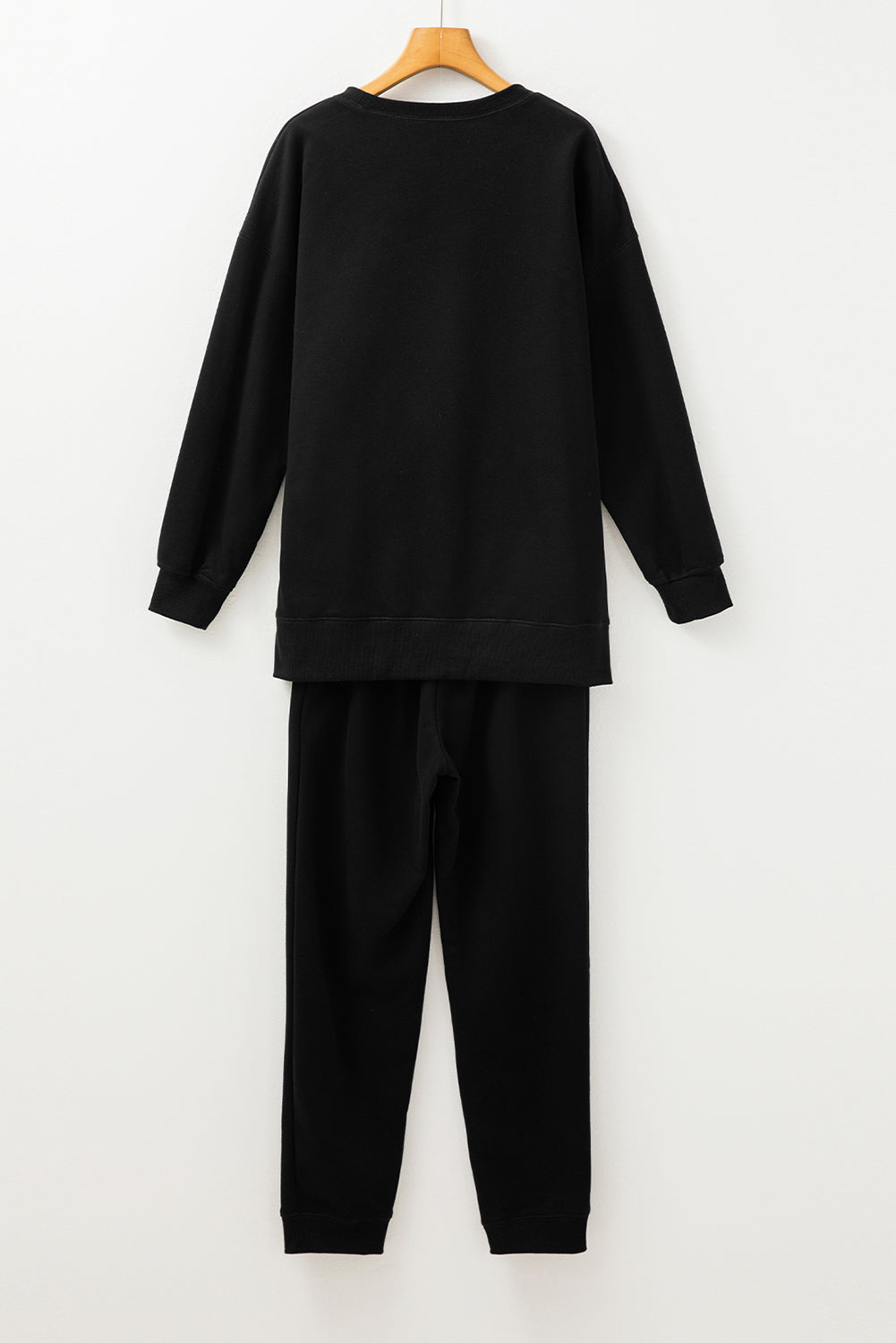 Stacey B's Black Solid Color High Low Pullover and Skinny Pants Set